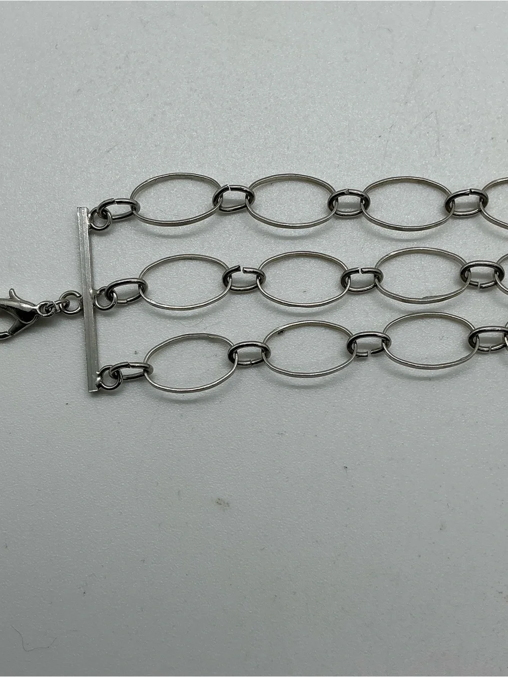 Silver Tone Metal Oval Link Chain 3 Strand Bracelet Lobster Clasp